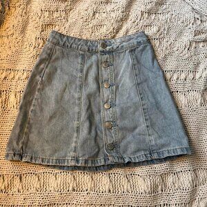 Cute spring blue denim mini skirt with button up...